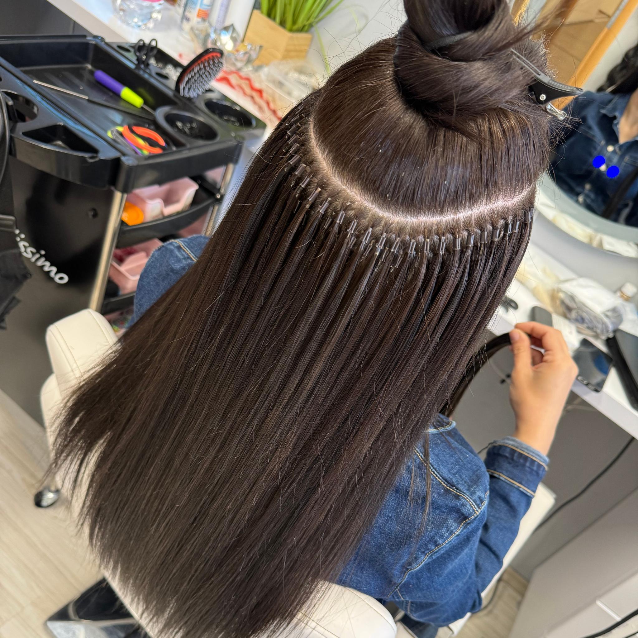 Keratin bond hair extension application at LuxeHair Atelier Hyderabad