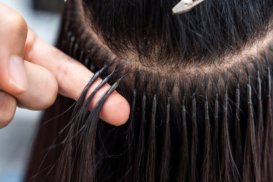 LuxeHair Atelier — professional tape extension application at Hitech City Hyderabad